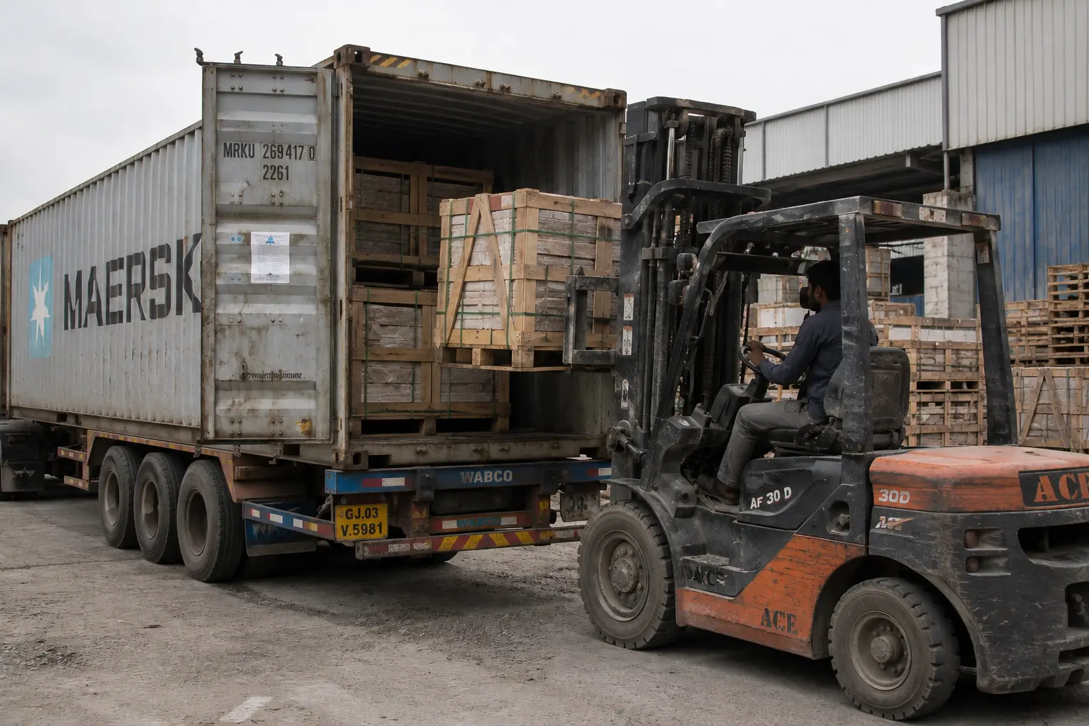 Bulk sandstone export container loading at sandstone manufacturing facility in India